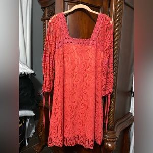 Cute coral knee length cotton lace overlay dress.